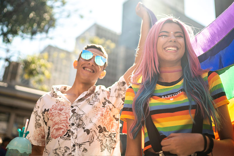 Two people celebrating during a pride parade
